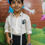 a child in tailor uniform